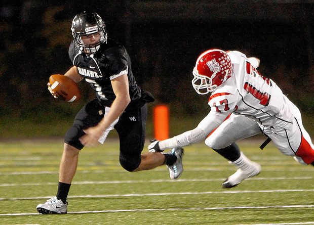 A football player running for the goal line