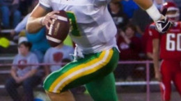 A football player running with the ball
