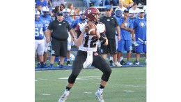 A football player is looking to pass the ball.