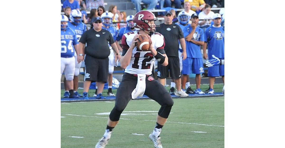 A football player is looking to pass the ball.