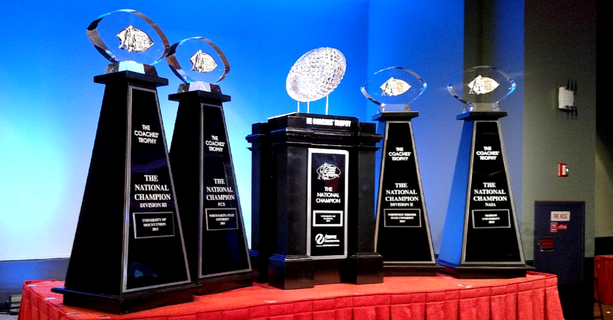 A group of trophies sitting on top of a table.