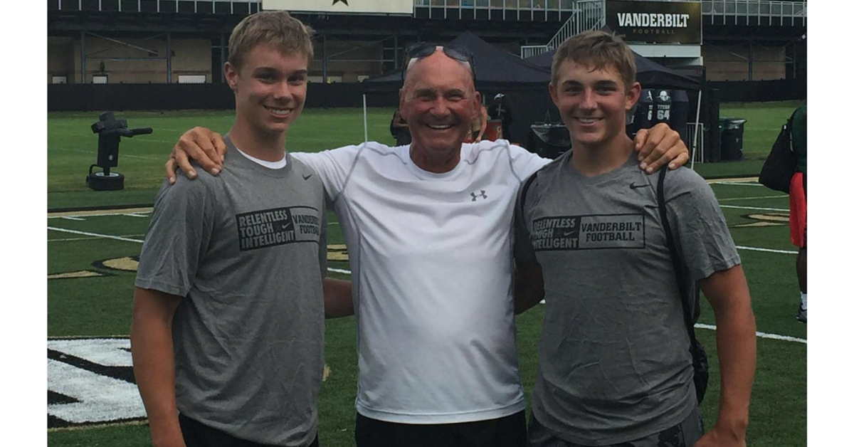 Three young men standing next to each other.