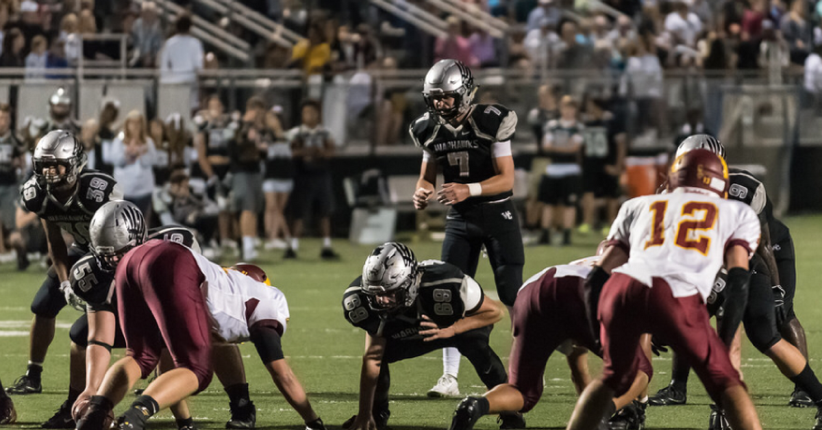 A group of football players on the field.