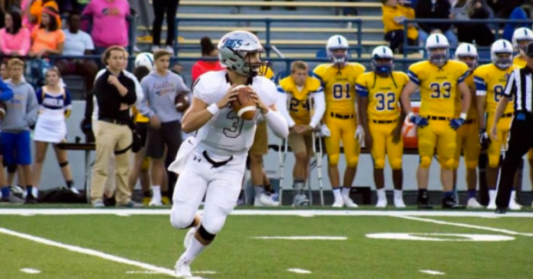 A football player running with the ball