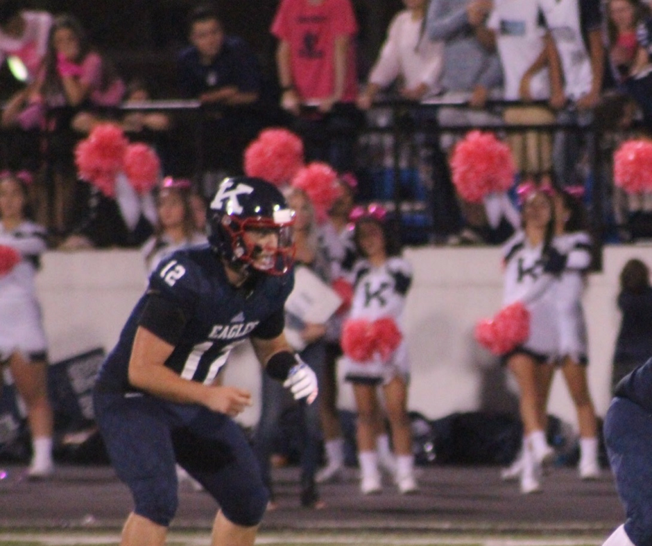 A football player in the middle of a game.